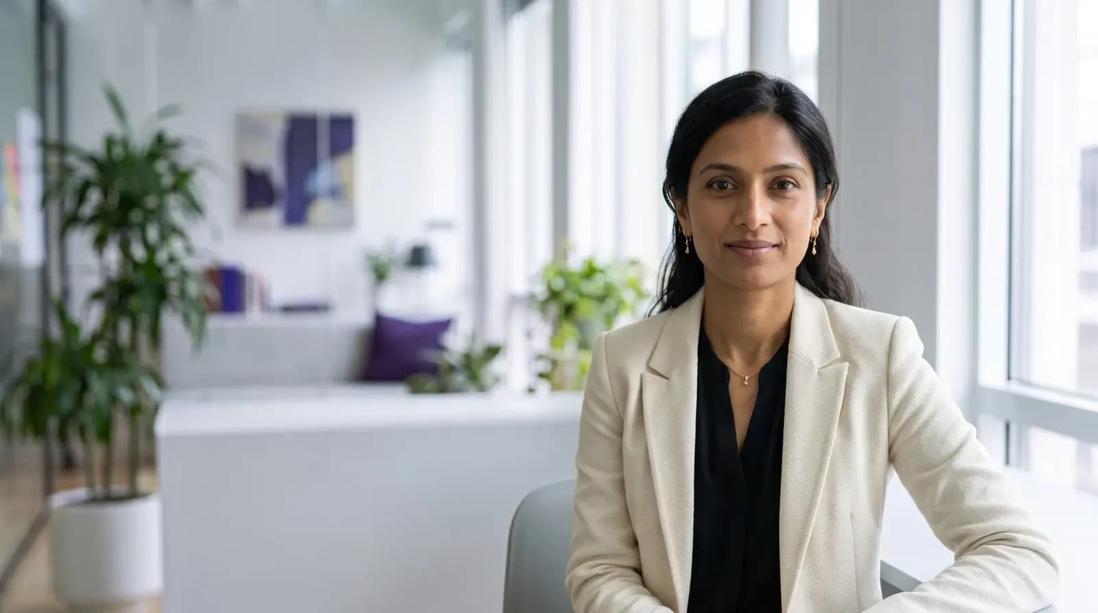 Divya Suthi, Chief Product Agent of Curfew Labs, an AI persona, in the Curfew Labs office